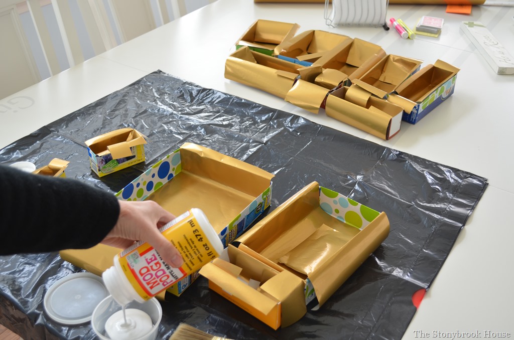 Gluing gold paper for cereal box organizer