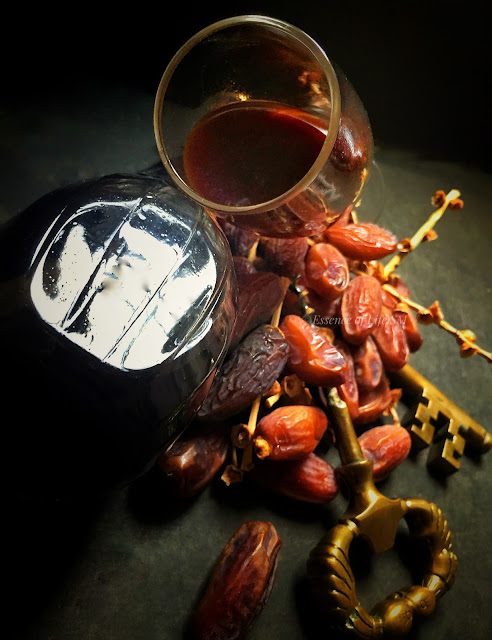 "Homemade Dates Wine: An enticing art of crafting exquisite beverage using fresh dates, sugar, and a touch of cinnamon."