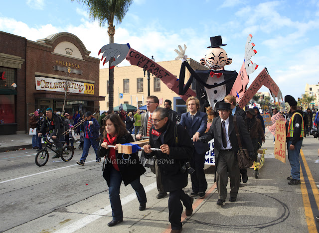 Monopoly Man, rose parade, occupy fights foreclosure, protest, float