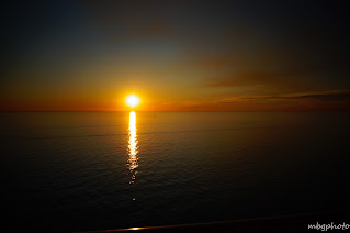 sunset reflected in ocean photo by mbgphoto