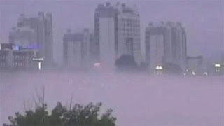 (China) - Ghostly mirage appears over river in Huanshan City