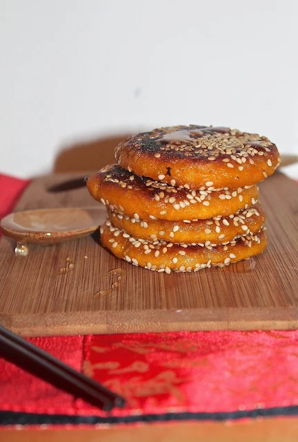 Side view of a stack of Chinese kabocha squash and sesame panckaes.