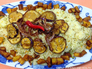 Couscous with fried egg plant, potato and onion