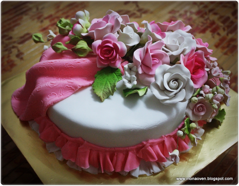 Romantic Pink Wedding Cake with Drapes and Scallops