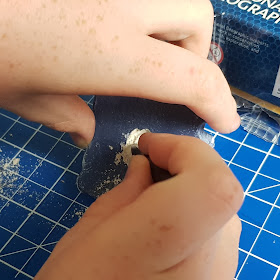 National Geographic Mini Dig Kits digging tool being used on the  plaster