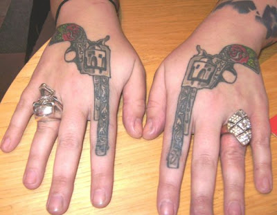 This is a best gun tattoos design on hands and i think that is very cool and 