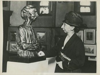 Miss Sarah Dover looking at the statue of herself 1931