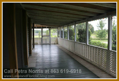 Having your coffee along the spacious porch of this home for sale in Kathleen FL will surely be an pleasurable experience as you take in the lush greens surrounding the property.