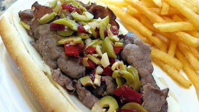 italian beef sandwich with olive relish topping