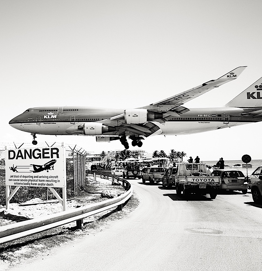 a Josef Hoflehner photograph of a low flying passenger jet