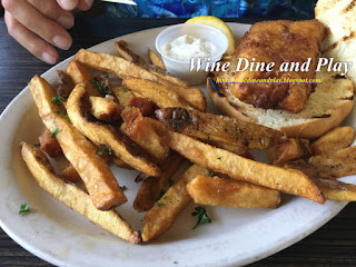 Deep-fried Atlantic cod fish sandwich with house-made tartar sauce at The Three Birds Tavern in St. Petersburg, Florida.