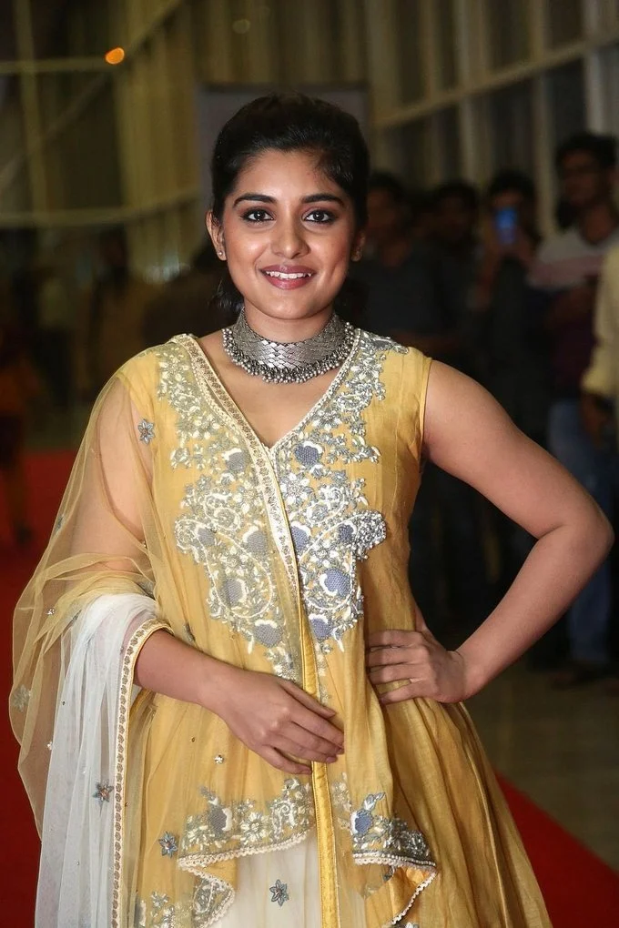 Beautiful Telugu Girl Niveda Thomas Long Hair Photos In Yellow Dress