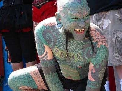Oh and this guy is almost completely covered in the lizard tattoo design now 
