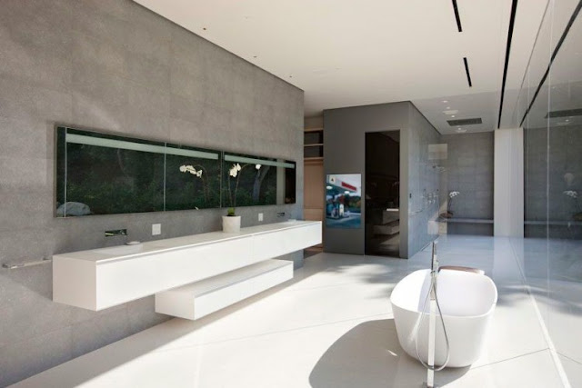 Picture of the minimalist bathtub and sinks on the wall