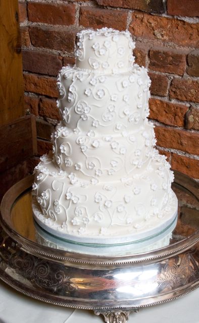 The 4 tier cake was rich fruit cake on the bottom vanilla sponge 