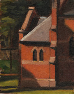 Oil painting of two small Gothic-style windows at the rear of a larger red brick church. 