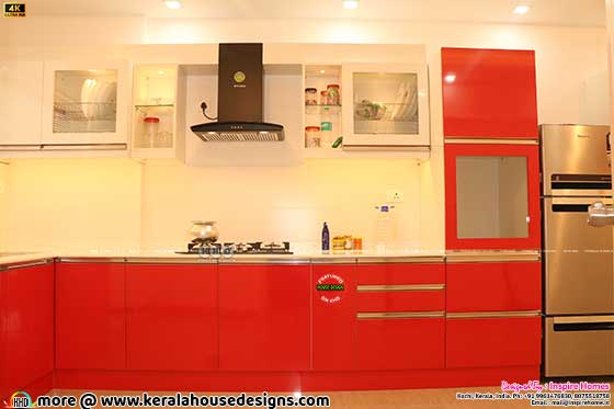 Finished red theme Kitchen interior photograph
