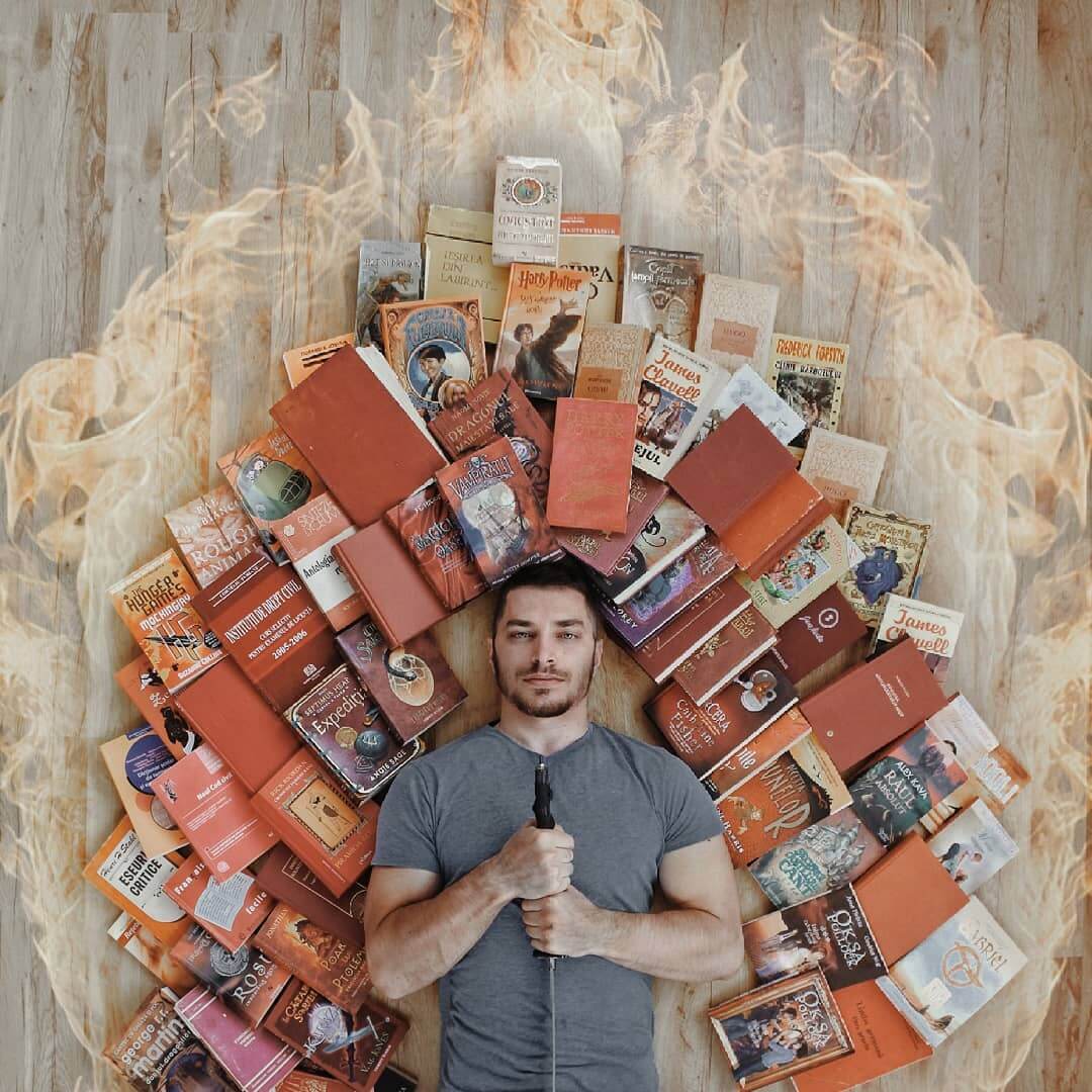 Guy Creatively Arranges His Huge Library of Books Into Artistic Scenes