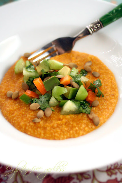 Bowl of pumpkin polenta topped with tomatillo avocado salsa and pumpkin seeds is gluten free and vegan