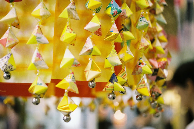 bright yellow tanabata decorations with many bells