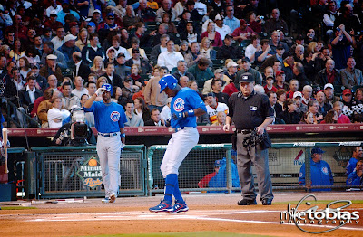 Soriano, gently touching home plate after smashing out a Roy Oswalt fastball Monday evening at Minute Maid Park