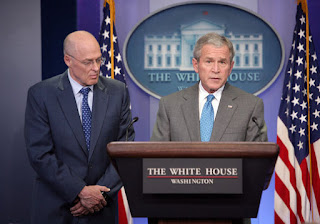 With Secretary of Treasury Hank Paulson looking on, President George W. Bush delivers a statement