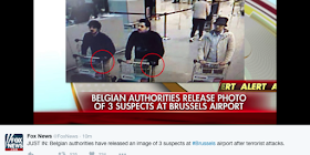 Τρεις άνδρες, με σκούρα μαλλιά, που σπρώχνουν καροτσάκια αποσκευών διακρίνονται σε αυτό το στιγμιότυπο, το οποίο δείχνει τους «υπόπτους» των επιθέσεων που προκάλεσαν τον θάνατο 14 ανθρώπων στο αεροδρόμιο, διευκρινίζει το Belga