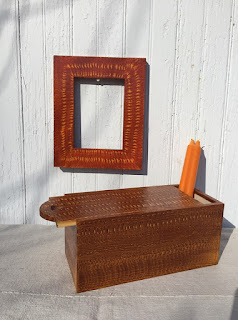 Wooden box and wooden picture frame painted orange with yellow graining