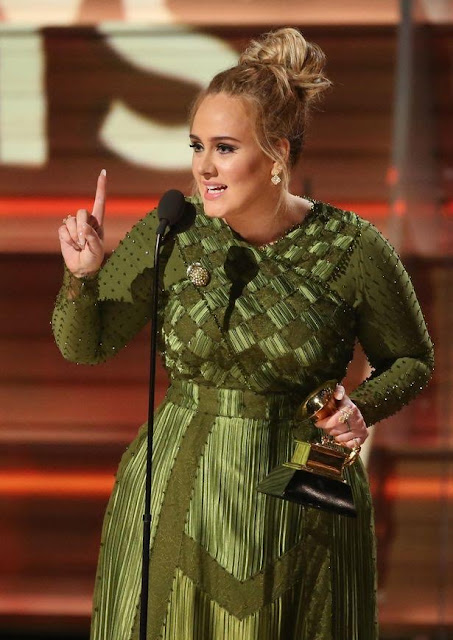 Adele confirms she's secretly married, slams estranged dad in Grammy Awards speech 