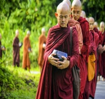 A person in a meditative pose , practicing Monk Mode to achieve extreme focus and discipline towards their chosen goal.