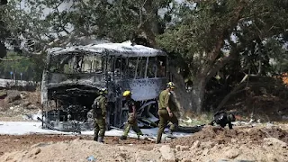 Iranian missiles hit buildings in Tel Aviv, and Israel claims to have killed a prominent Iranian military commander.