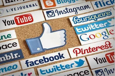 Social media platform logos arranged arround a thumbs-up sign.