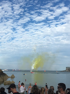 fireworks and color streams at the swim start