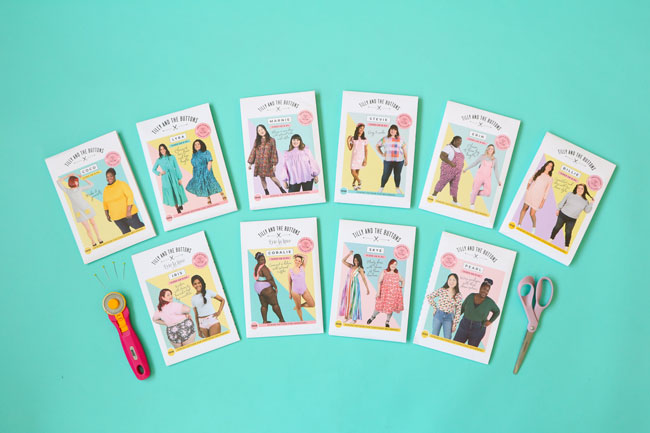 Overhead shot of a collection of Tilly and the Buttons sewing patterns in inclusive sizes on turquoise background