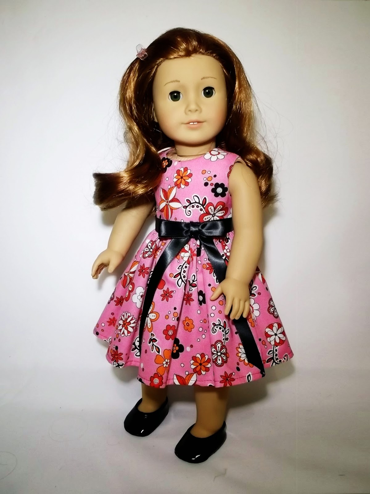 http://www.bonanza.com/listings/American-Girl-Clothes-and-18-Doll-Pink-Flowers-Dress-and-Ribbon-Belt-with-Bow/232435556