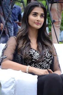 Actress Pooja Hegde Stills in black dress at Valmiki movie Press Meet