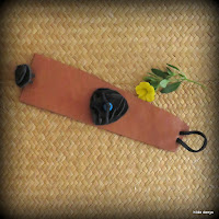 LoveLea's brown leather cuff with black leather flower.