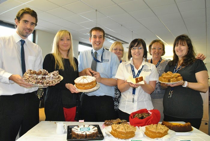 Garador staff with home-made cakes at Macmillan charity coffee morning