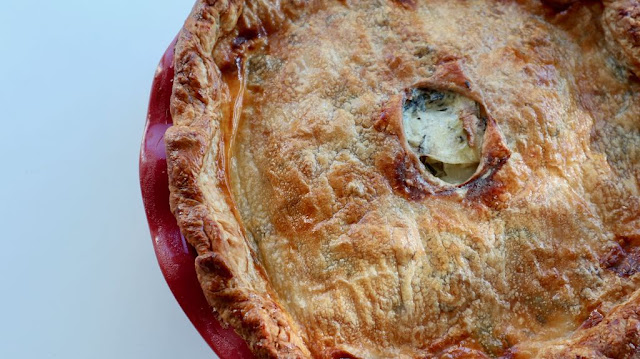 potato tourte in a red pie dish