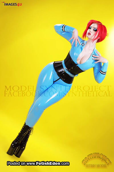 Light blue latex catsuit Synthproject red-haired lady with black latex corset and long black PVC boots