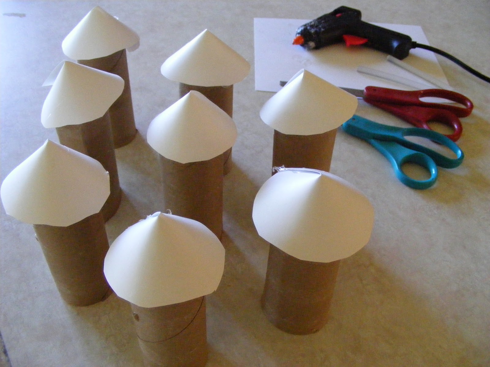 ... ahead and glue your rocket tops to the end of each toilet paper roll