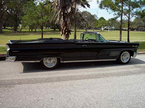 Black 1965 Lincoln Continental with suicide doors, à la Entourage.