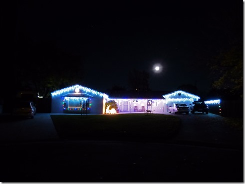 Sister's House dressed up for Christmas with Super Moon over House