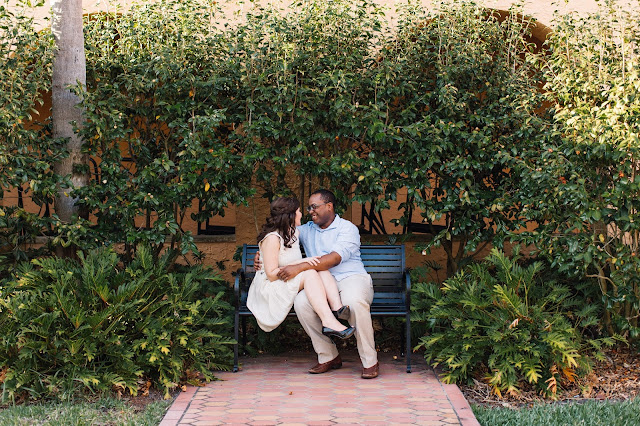 engagement photo of couple on bench