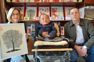 Paper artist Zhang Yonghong in his shop in Nanluoguxiang