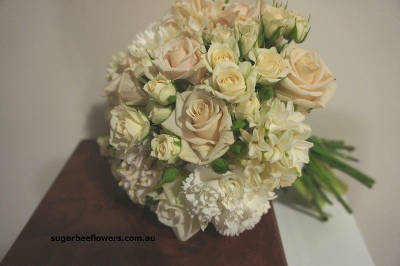 Round bouquet with cream rose cream spray rose white carnation and white 