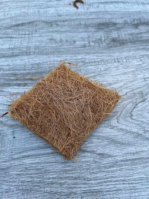 Photo of a square of coco liner.