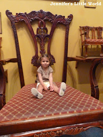 Child sitting on an enormous chair