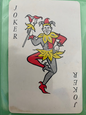 dancing jokers, holding jesters wands, facing directly forward