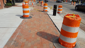 brick being laid on the sidewalks downtown